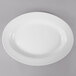 A white oval Thunder Group melamine platter with a white rim.