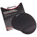 A black Innovera mouse pad with a gel wrist rest on a table with a box.