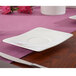 A white Villeroy & Boch Modern Grace bone porcelain saucer on a table.