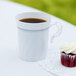 a cup of coffee and a cupcake