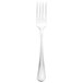 A silver Walco Marcie European table fork with a white handle.