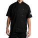 A man wearing a black Chef Revival long sleeve chef coat.