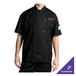 A man wearing a black Chef Revival long sleeve chef coat.