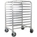 A silver metal Regency sheet pan rack with wheels.