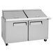 A Turbo Air Mega Top Refrigerated Sandwich Prep Table with two doors on a counter.