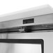 A stainless steel Turbo Air refrigerated sandwich prep table on a counter.