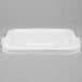 A white plastic Continental lid with black handles.
