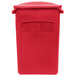 A red plastic Rubbermaid Slim Jim rectangular trash can with a 2 hole lid.