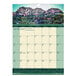 A House of Doolittle wall calendar with a rocky mountain and blue sky in the background.