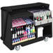 a black bar cart with bottles of beverages