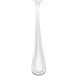 A close-up of a Walco stainless steel teaspoon with a white background.