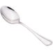 A close-up of a Walco stainless steel teaspoon with a silver handle.