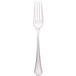 A close-up of a Walco stainless steel table fork with a black and silver handle.