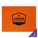 An orange rectangle placemat with a white and purple H. Risch, Inc. logo.