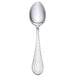 A Walco stainless steel teaspoon with a silver handle.