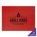 A red faux leather placemat with black text that reads "Grill Haus"