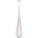 A Walco stainless steel bouillon spoon with a white handle.