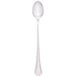 A stainless steel Walco Prim iced tea spoon with a long stem and a silver rim.