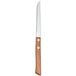 A Libbey stainless steel steak knife with a wooden handle.