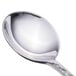 A close-up of a Walco stainless steel bouillon spoon with a silver handle.