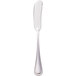A silver Walco stainless steel flat handle butter spreader.