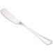 A Walco stainless steel butter spreader with a flat handle.