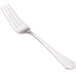 A close-up of a Walco stainless steel dinner fork with a silver handle.