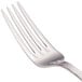 A close-up of a Walco stainless steel dinner fork with four prongs.