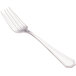A close-up of a Walco stainless steel fish fork with a flat silver handle.