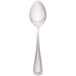 A Walco stainless steel dessert spoon with a silver handle.