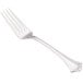 A close-up of a Walco stainless steel table fork with a long silver handle.