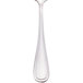 A Walco stainless steel tablespoon with a black handle.