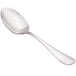 A Walco stainless steel serving spoon with a silver handle on a white background.