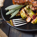 A plate of food with a Walco European dinner fork.