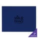 A blue faux leather placemat with black text reading "milk & honey cafe"