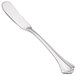 A Walco stainless steel flat handle butter spreader.