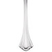 A Walco stainless steel butter spreader with a flat handle.