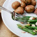 A plate of food with a Walco Ultra stainless steel table fork.