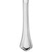 A Walco stainless steel dinner knife with a white handle.