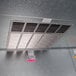 A metal vent in the interior of a Norlake floorless walk-in cooler.