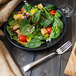 A plate of salad with a Walco Freya salad fork.