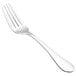 A close-up of a Walco stainless steel salad fork with a silver handle.