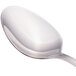 A Walco stainless steel serving spoon with a silver handle.