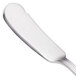 A close-up of a Walco stainless steel butter spreader with a flat handle.