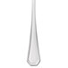 A Walco stainless steel butter spreader with a flat white handle.