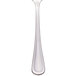 A Walco stainless steel serving spoon with a pierced bowl and a white handle.