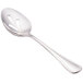 A Walco stainless steel serving spoon with a pierced handle.