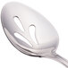 A close-up of a Walco stainless steel pierced serving spoon with a white background.