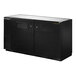 A black metal True back bar refrigerator with two solid doors.