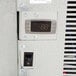 A digital display on a control panel for a Norlake Kold Locker indoor walk-in freezer.